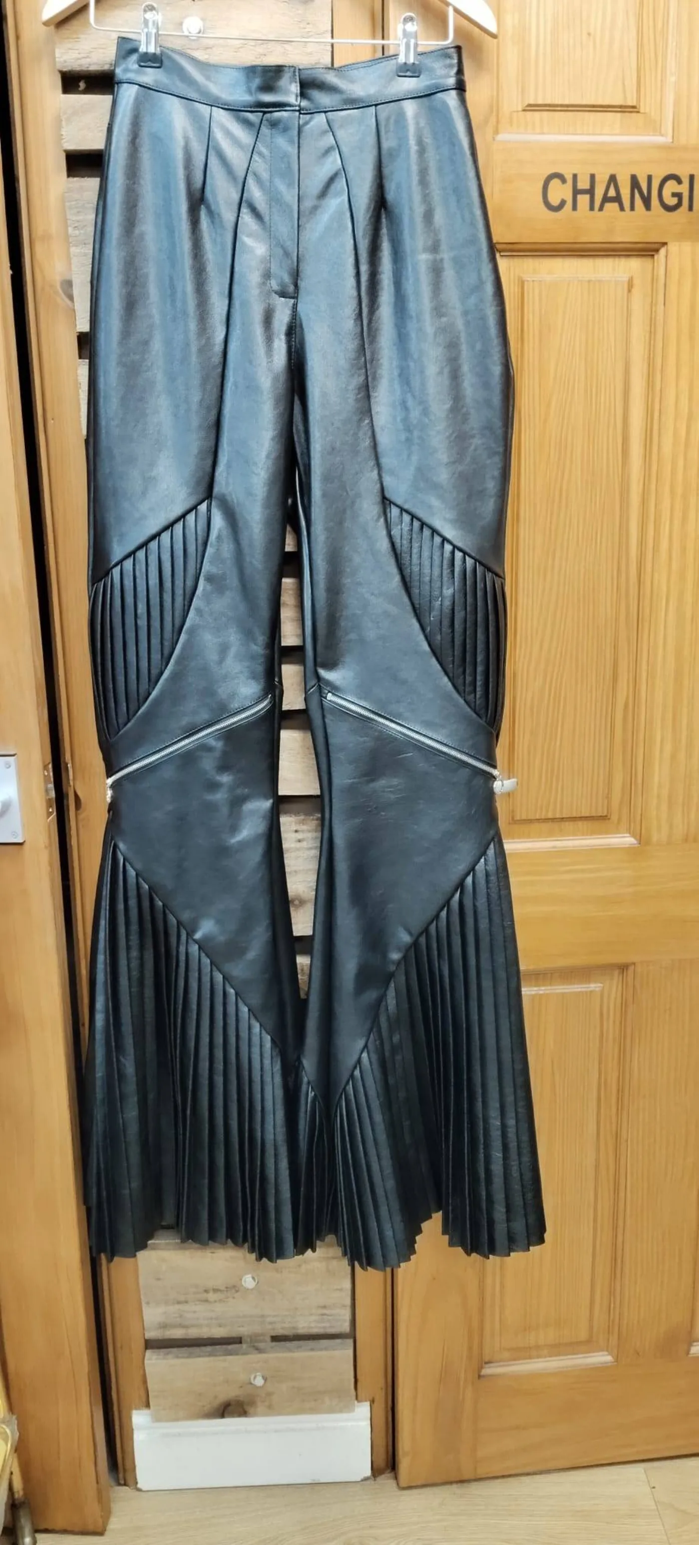 Bespoke black leather wide-leg pleated flare trousers with zip details — Openfit Nottingham